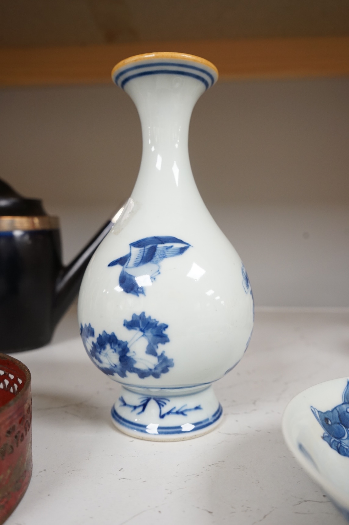 A Chinese blue and white vase and a ‘fish’ saucer dish, largest 19cm high